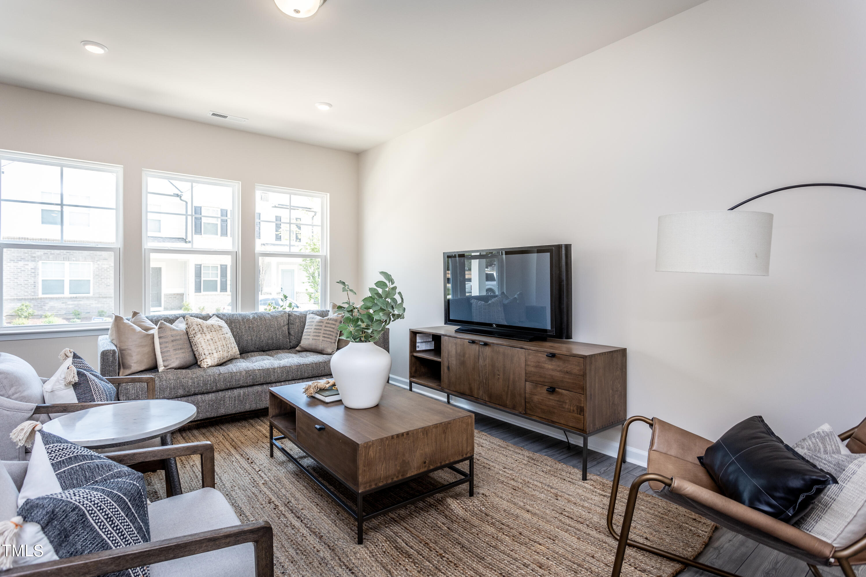 5603 Edessa Avenue Raleigh, NC 27603 - Photo 3 of 21 a living room with furniture and a flat screen tv