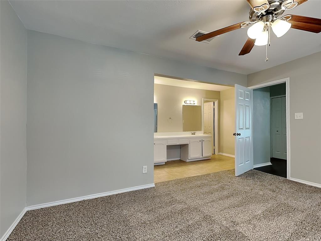 7621 Pebble Beach Drive Rowlett, TX 75088 - Photo 9 of 20 a view of an empty room with a bathroom