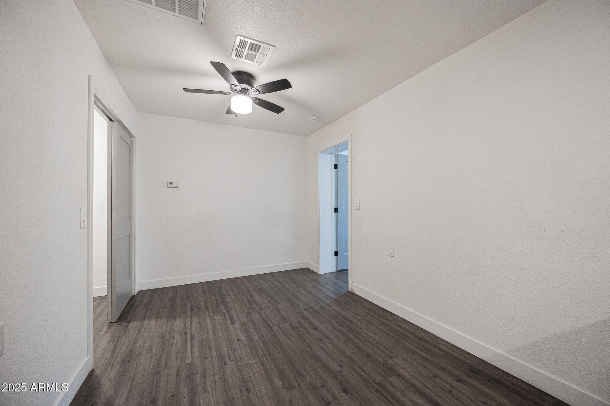 2802 North 36th Street, Unit 3 Phoenix, AZ 85008 - Photo 13 of 23 wooden floor in an empty room