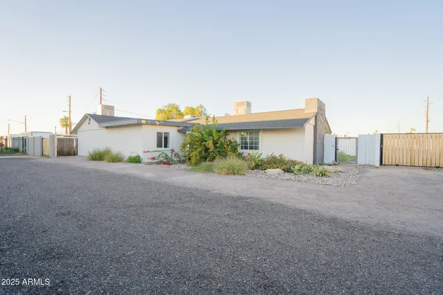 a front view of a house with a yard and a garage