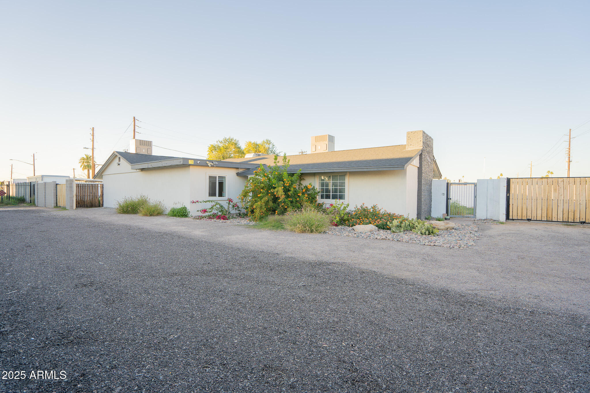 2802 North 36th Street, Unit 3 Phoenix, AZ 85008 - Photo 2 of 23 a front view of a house with a yard and a garage