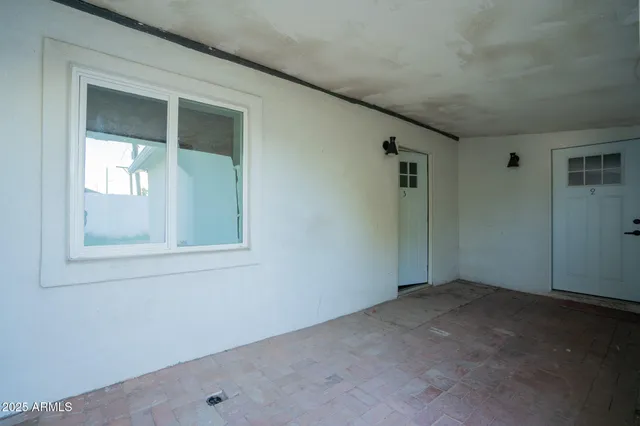 an empty room with windows