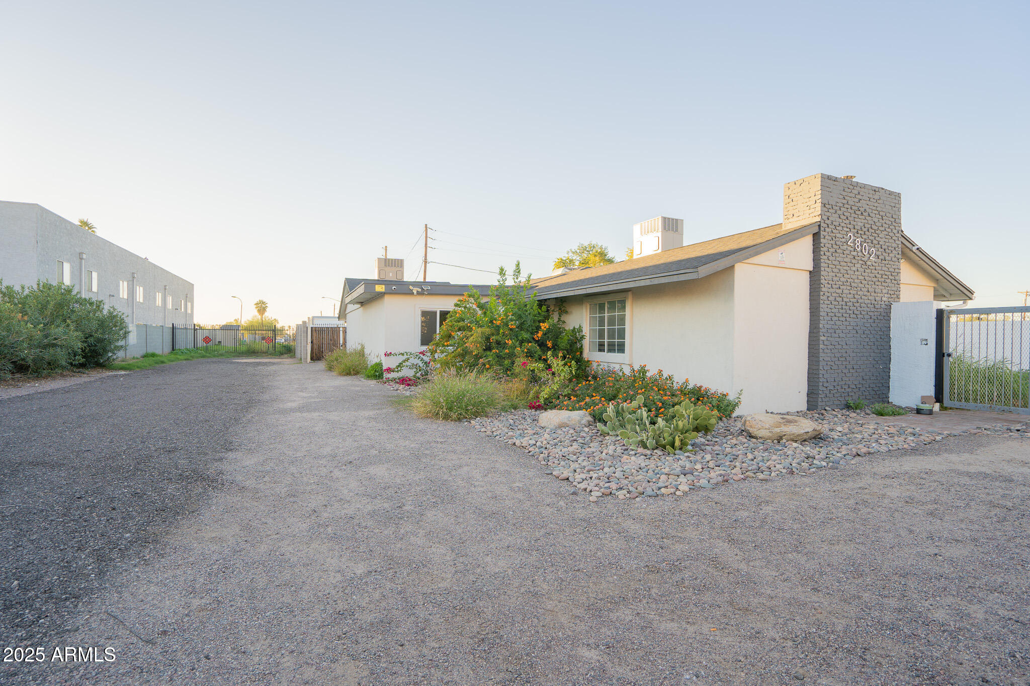 2802 North 36th Street, Unit 3 Phoenix, AZ 85008 - Photo 3 of 23 a view of a house with a yard and plants