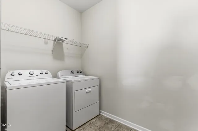 a view of utility room with dryer and washer