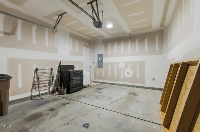 a view of a refrigerator in kitchen and utility room