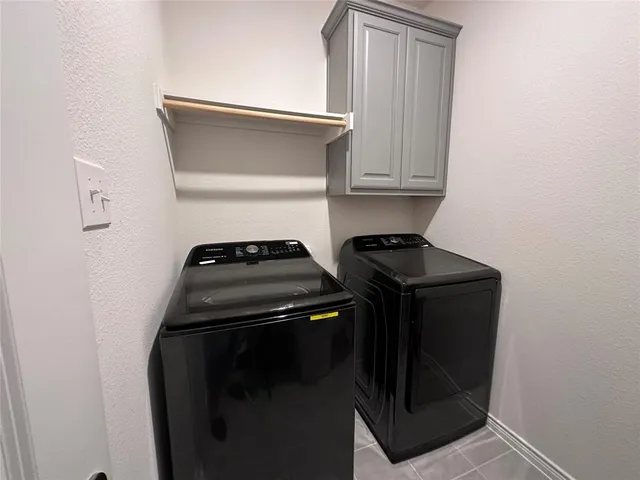 a close view of a stove top oven and cabinets