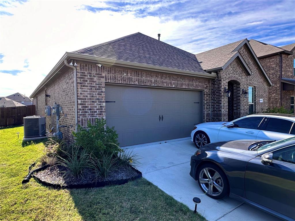 1016 Sublime Drive Forney, TX 75126 - Photo 13 of 15 a front view of a house with a garden