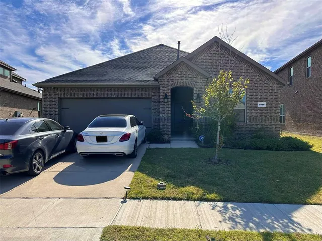 a car parked in front of a house