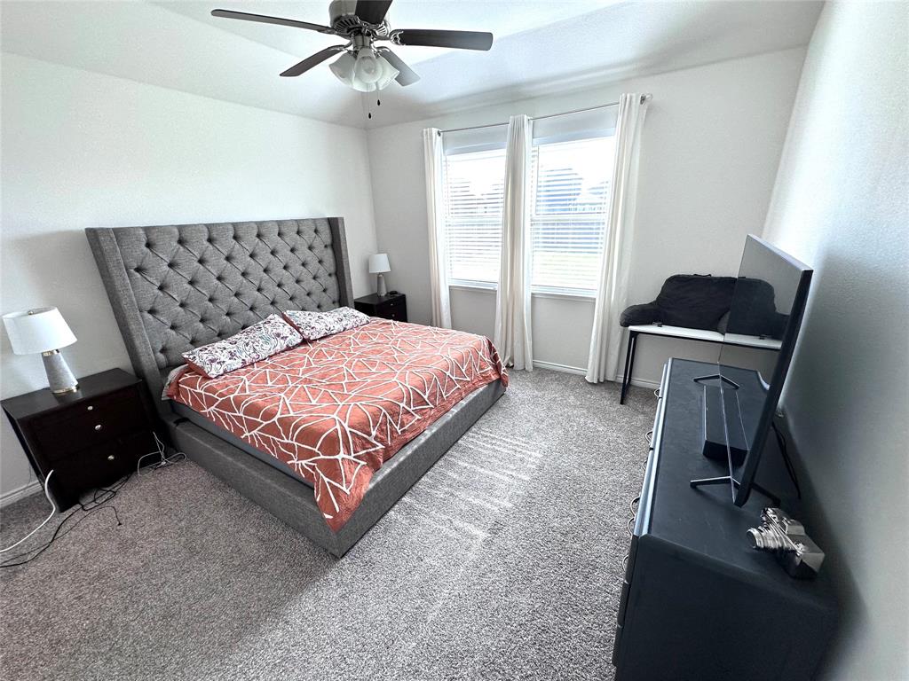 1016 Sublime Drive Forney, TX 75126 - Photo 6 of 15 a bedroom with a bed and window