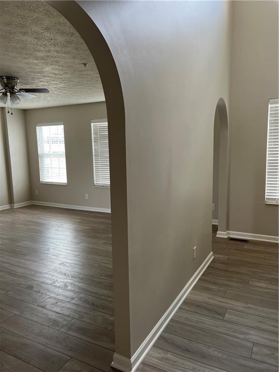102 Alderwood Drive Greensburg, PA 15601 - Photo 4 of 12 an empty room with wooden floor and windows