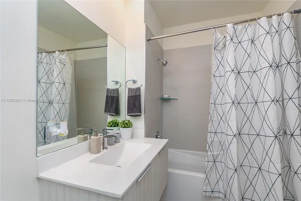 a kitchen with stainless steel appliances a stove refrigerator sink and microwave