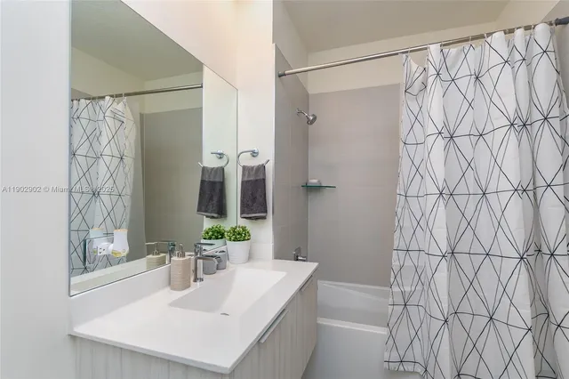 a kitchen with stainless steel appliances a stove refrigerator sink and microwave