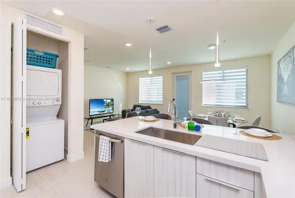 a kitchen with a stove sink and microwave