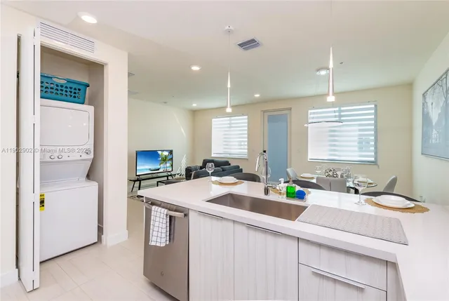 a kitchen with a stove sink and microwave