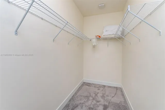 a bedroom with a bed and a table