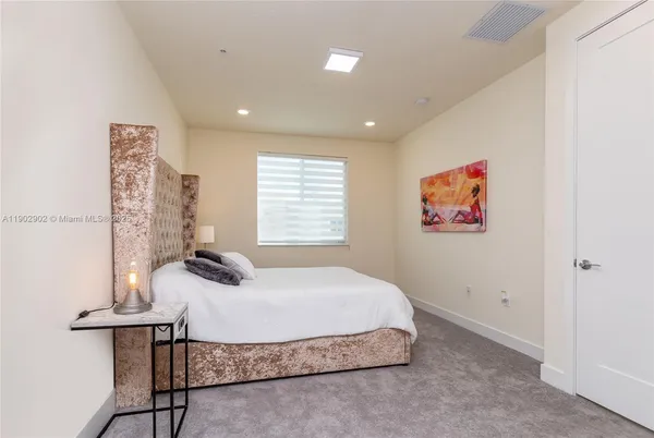 a living room with a couch and a rug