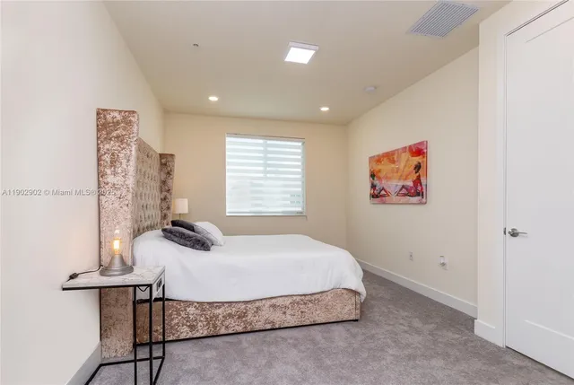 a living room with a couch and a rug