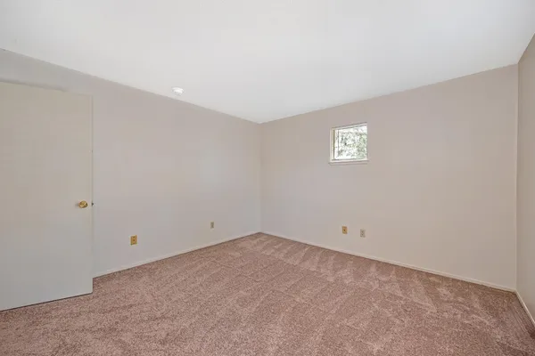 a bathroom with a toilet a sink a vanity and mirror