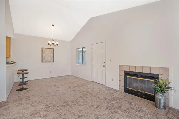 a view of empty room with a fireplace