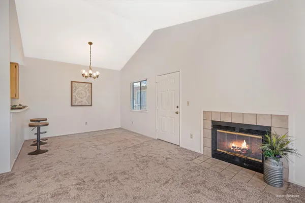a view of empty room with a fireplace