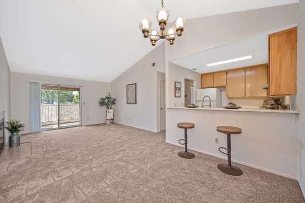 a view of kitchen with furniture and windows