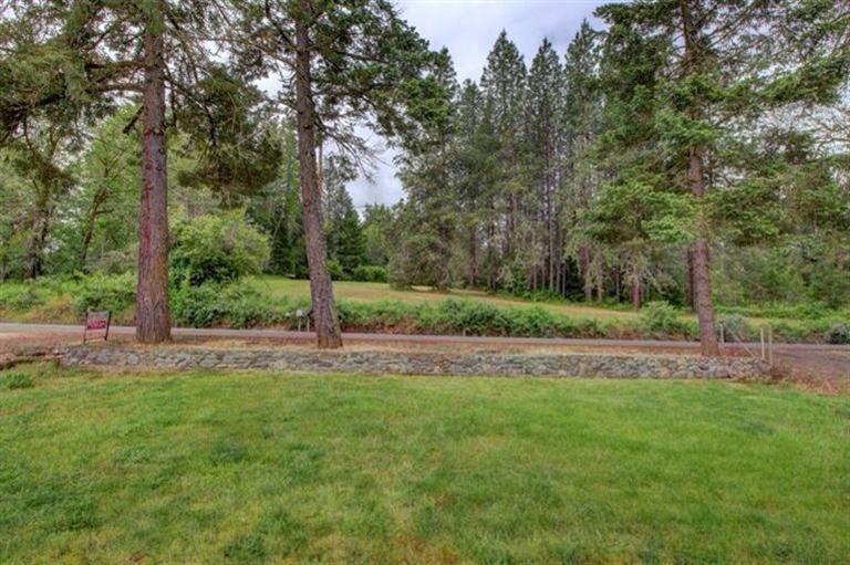 1819 Rounds Avenue Grants Pass, OR 97527 - Photo 11 of 17 View from the front. These trees provide