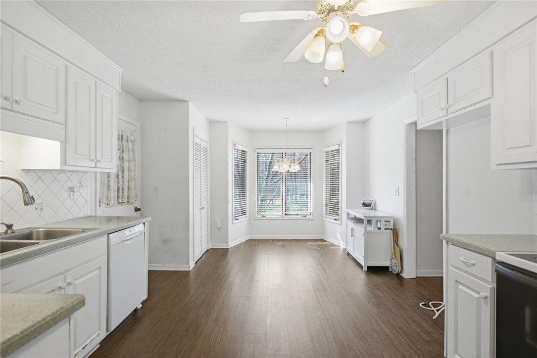 308 Wildwood Road Walhalla, SC 29691 - Photo 6 of 23 This bright kitchen and dining area features sleek flooring and ample cabinet space.