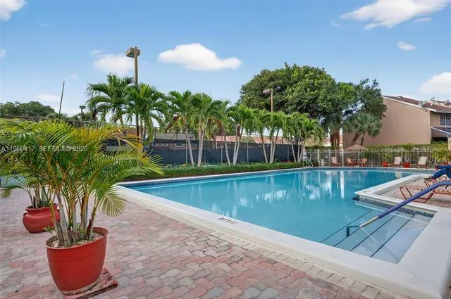 a view of a swimming pool with a lounge chairs