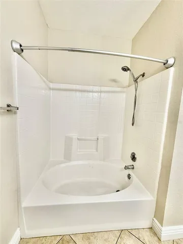 a bathroom with a bath tub