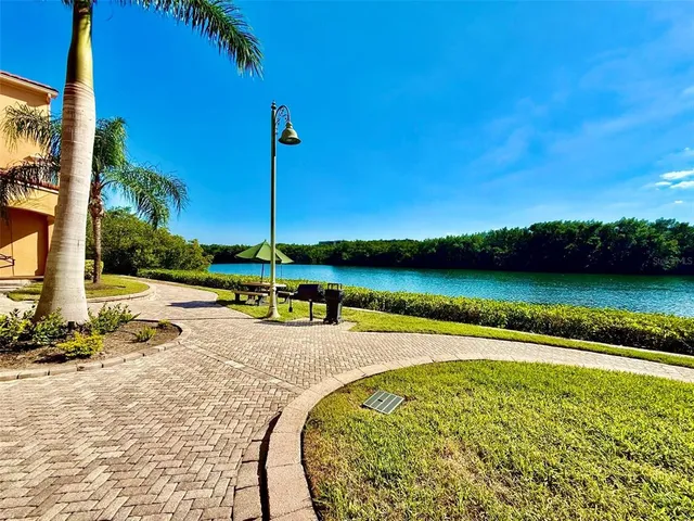 a view of swimming pool with a table and chairs