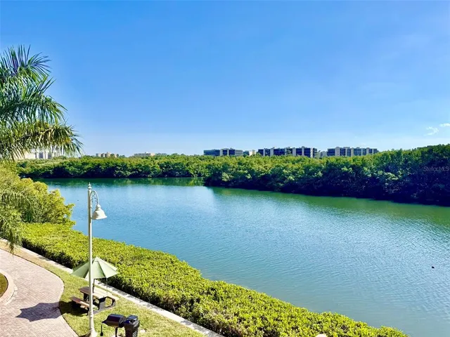 a view of a lake with a house in the background