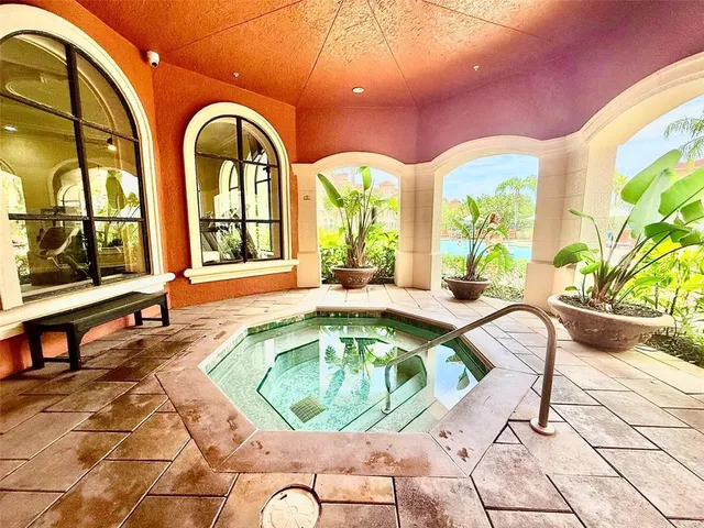 a view of a swimming pool with outdoor seating