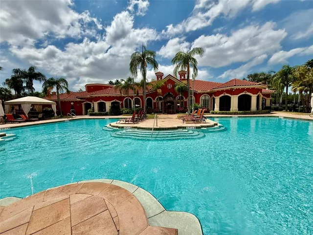 a room with lots of furniture and a chandelier