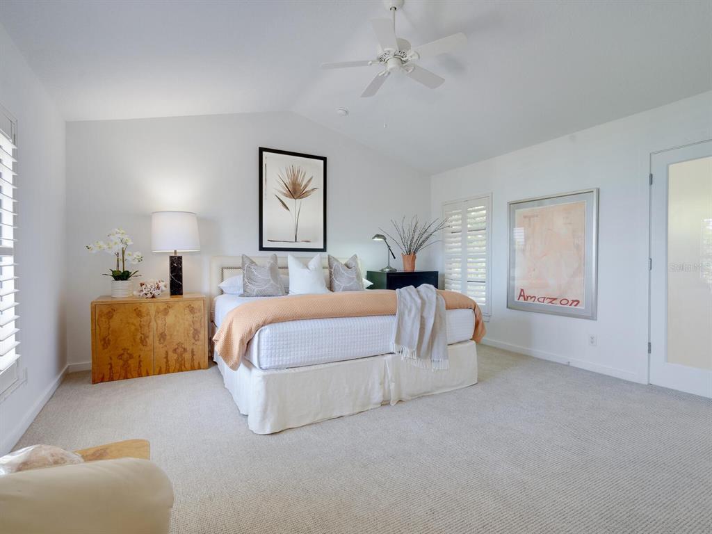 3201 Casey Key Road Nokomis, FL 34275 - Photo 17 of 98 a bed room with bed and a night stand