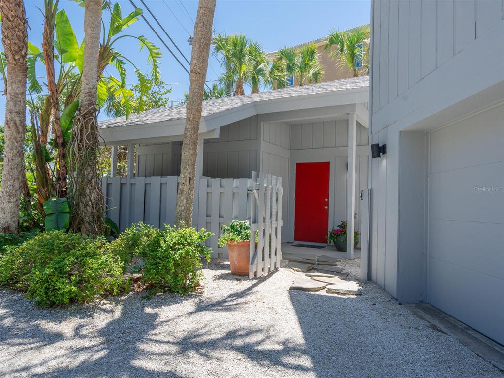 3201 Casey Key Road Nokomis, FL 34275 - Photo 28 of 98 a front view of a house with a yard