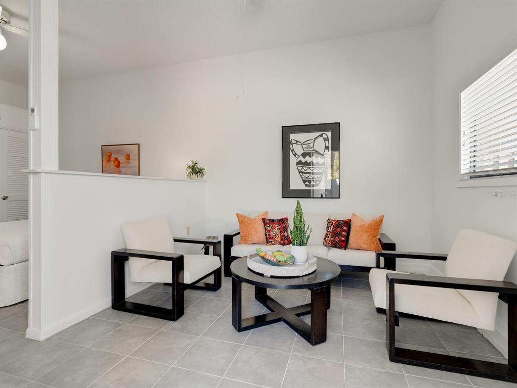 3201 Casey Key Road Nokomis, FL 34275 - Photo 29 of 98 a living room with furniture and a window