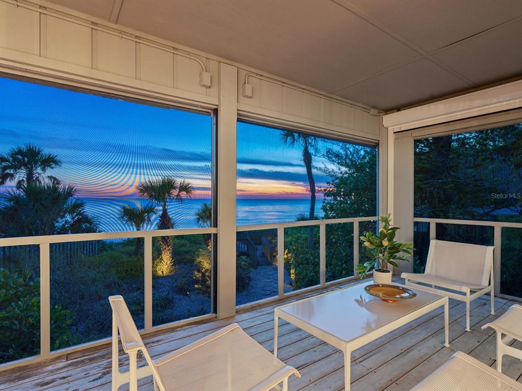 3201 Casey Key Road Nokomis, FL 34275 - Photo 49 of 98 a outdoor space with the couches and dining table with the garden view