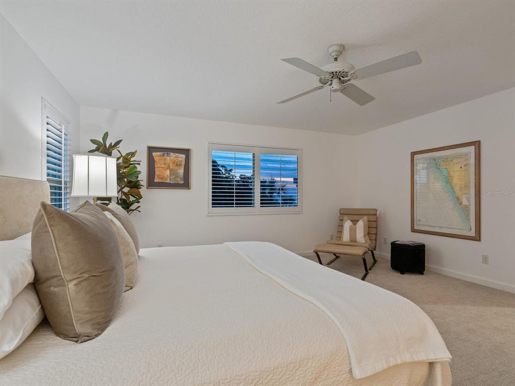 3201 Casey Key Road Nokomis, FL 34275 - Photo 55 of 98 a bedroom with a bed and window