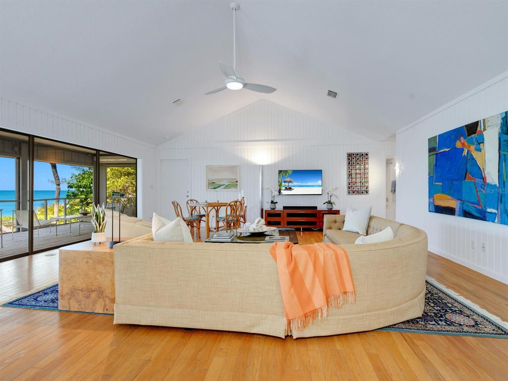 3201 Casey Key Road Nokomis, FL 34275 - Photo 78 of 98 a living room with furniture and a flat screen tv