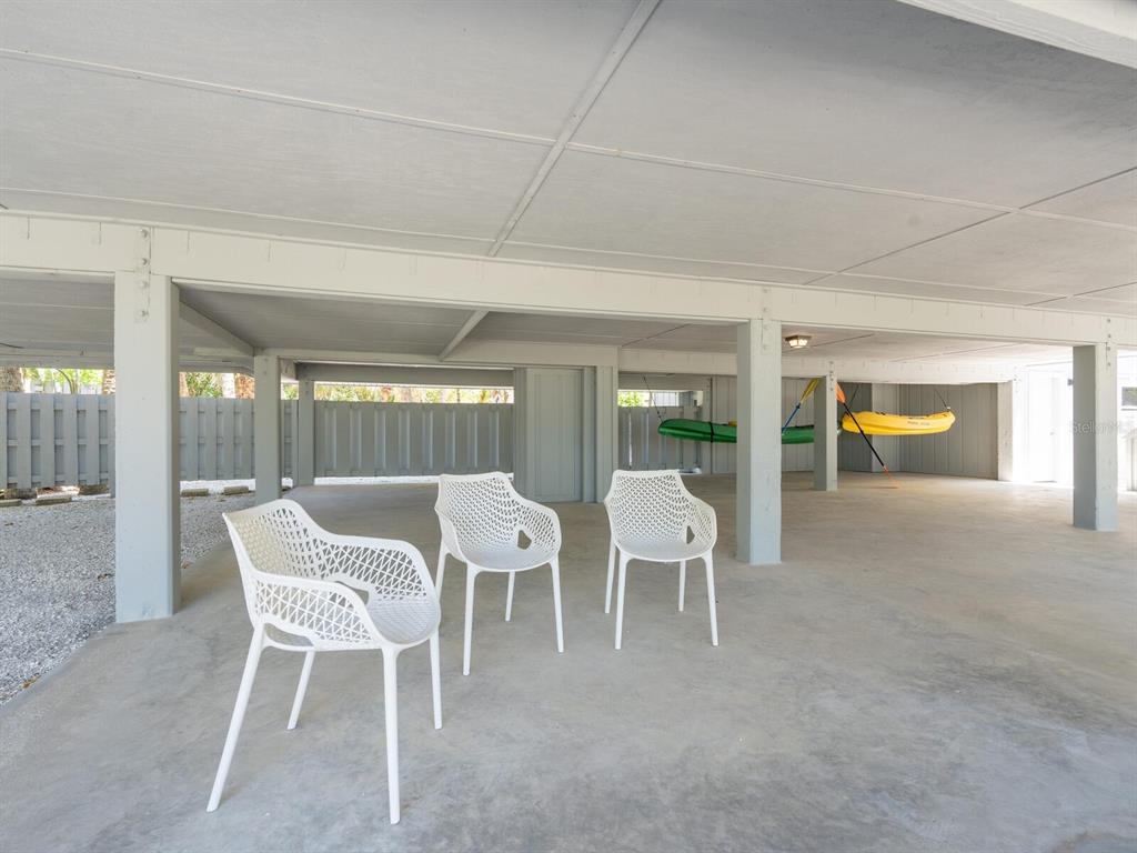 3201 Casey Key Road Nokomis, FL 34275 - Photo 89 of 98 a view of a chairs and table in patio
