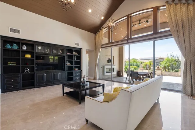 a kitchen with stainless steel appliances kitchen island granite countertop a stove a sink and a refrigerator