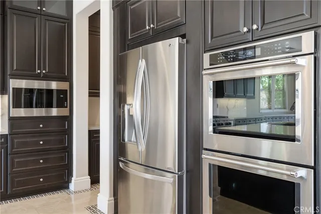 a view of room with wooden cabinets