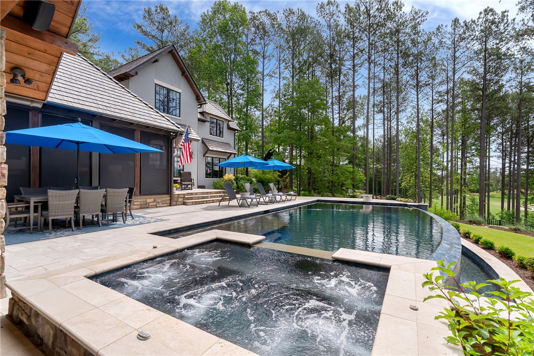 119 Drewberry Lane Sunset, SC 29685 - Photo 22 of 42 This exquisite property offers a private oasis with a sparkling pool and spa, perfect for outdoor living.