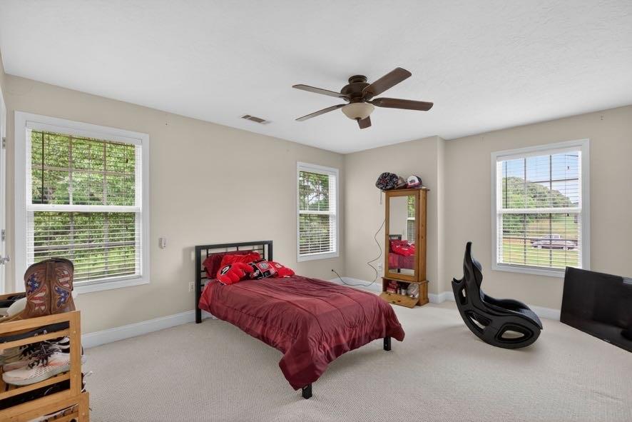15 Fast Lane Ranburne, AL 36273 - Photo 19 of 51 a bedroom with a bed a couch and a window
