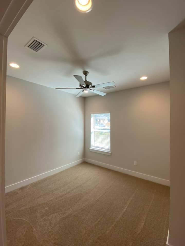 400 Fanny Ann Way Freeport, FL 32439 - Photo 13 of 20 an empty room with a window and a ceiling fan