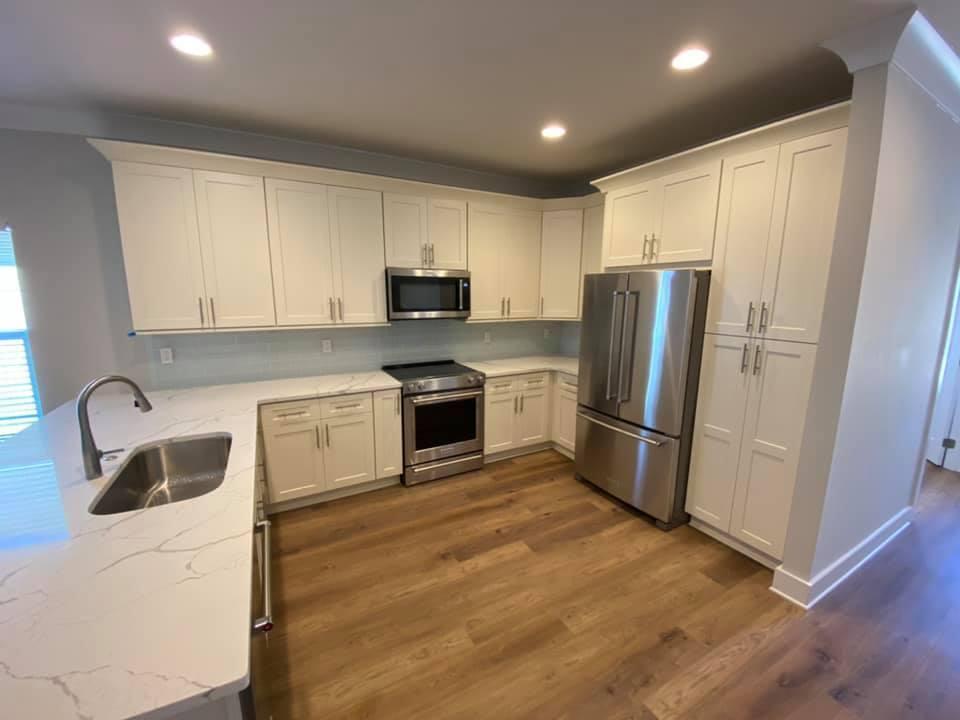400 Fanny Ann Way Freeport, FL 32439 - Photo 6 of 20 a kitchen with a refrigerator sink and cabinets