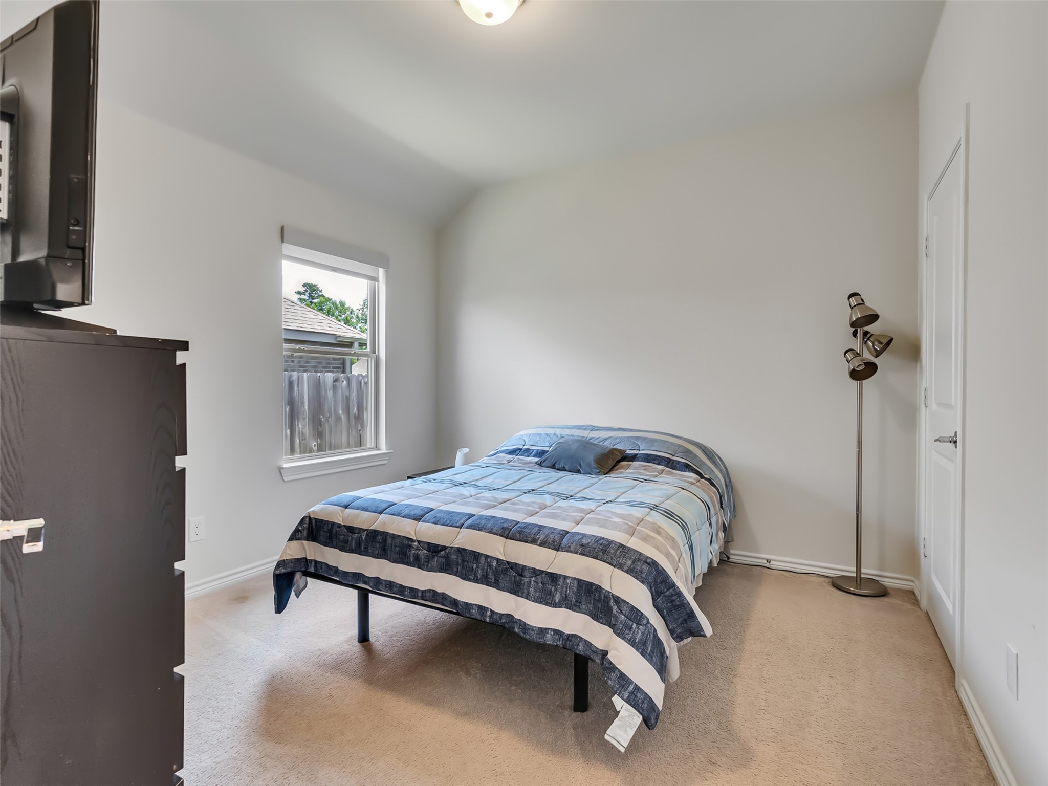 27997 Lone Hollow Lane Spring, TX 77386 - Photo 36 of 45 a bedroom with a bed and a window
