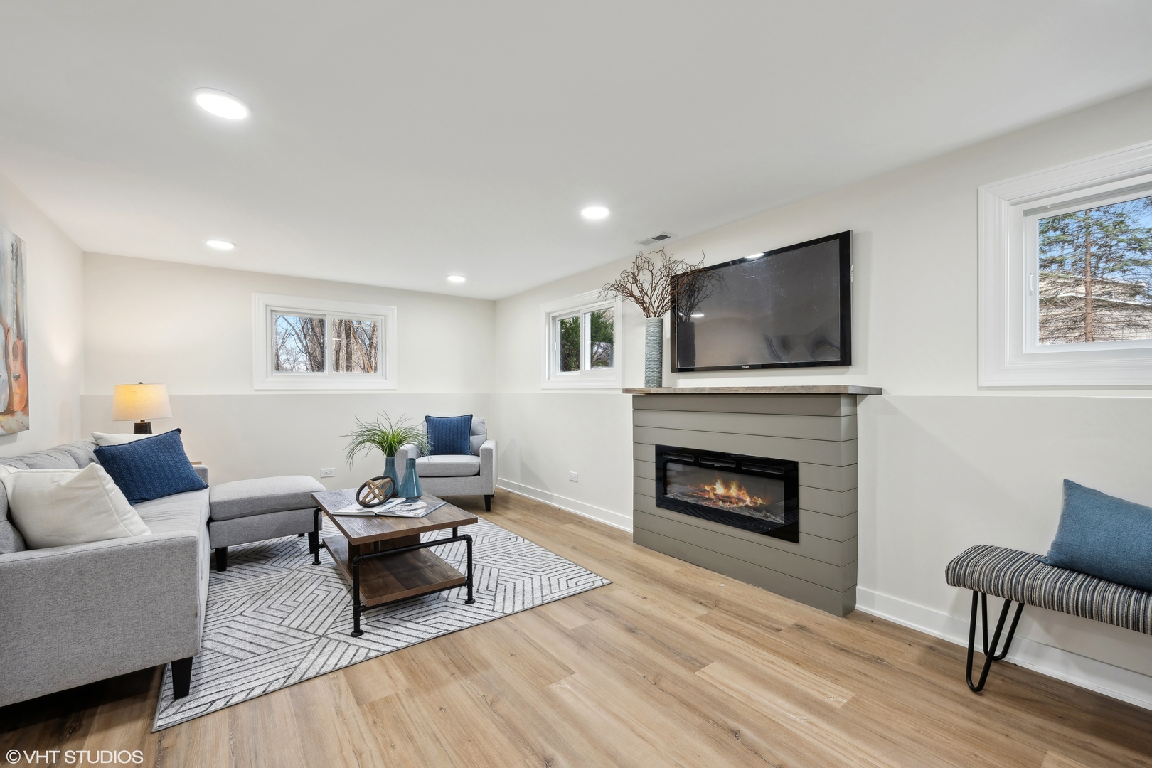 26340 West Merton Road Barrington, IL 60010 - Photo 16 of 22 a living room with furniture a fireplace and a flat screen tv
