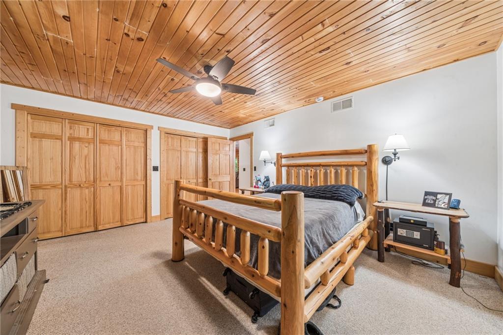 905 Indian Creek Valley Road Normalville, PA 15469 - Photo 18 of 38 a bed sitting in a spacious bedroom next to a window