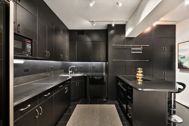 a kitchen with a sink and stove